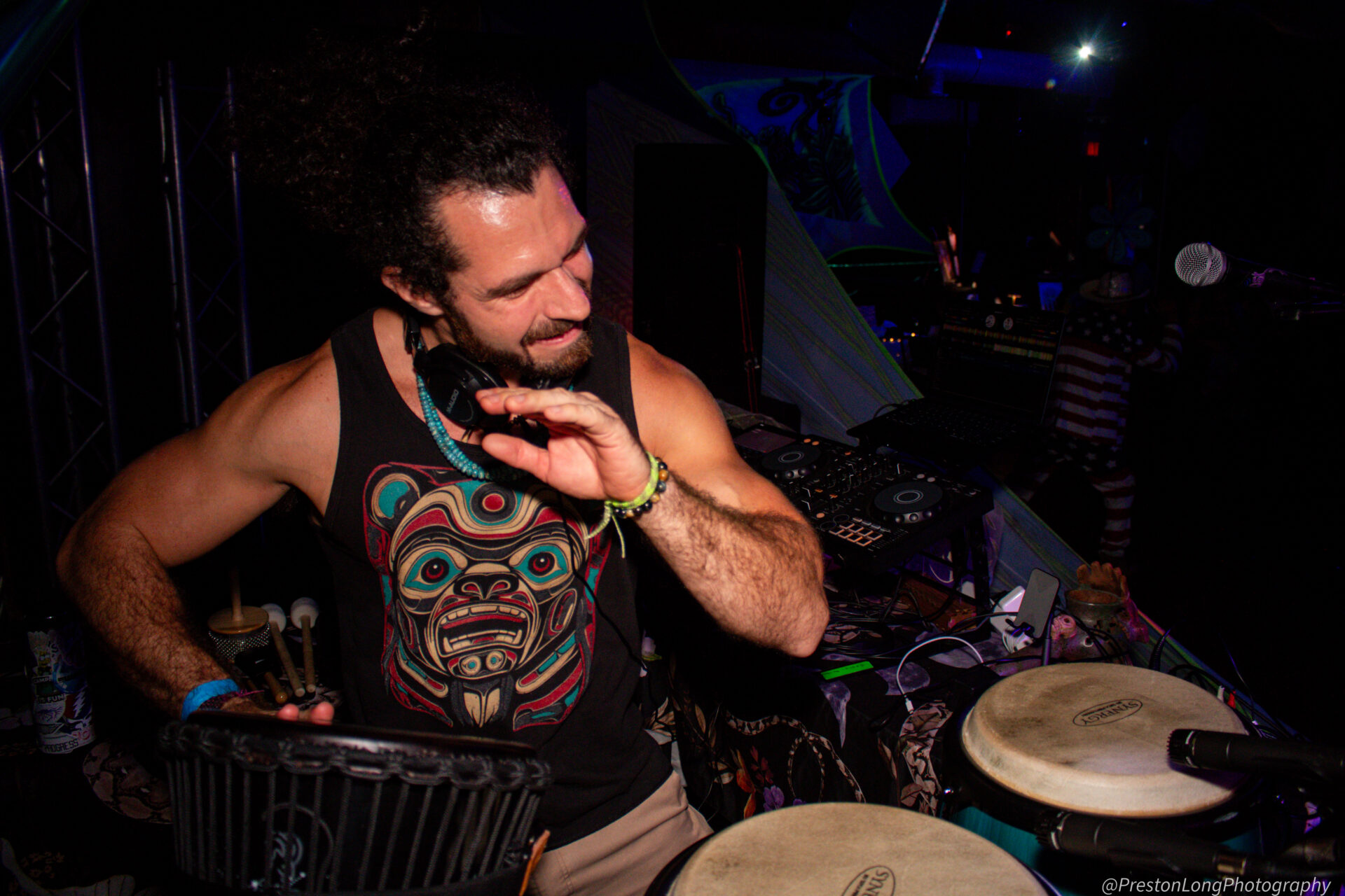 Ghost Pipe, the DJ, playing congas.